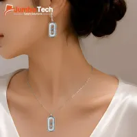 طقم إكسسوار — سلسلة وحلق بتصميم بيضاوي مع أحجار متحركة